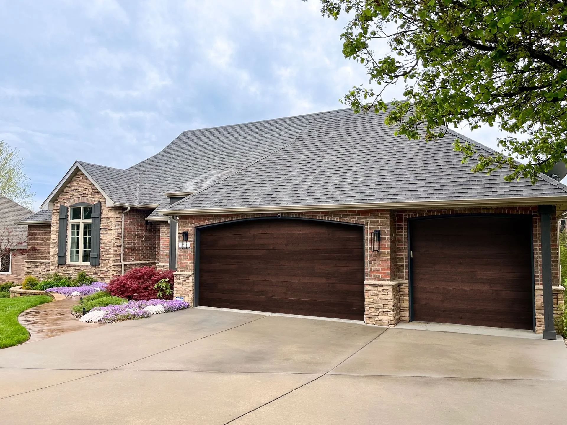 Raynor Aspen insulated steel garage door with carriage-house styling