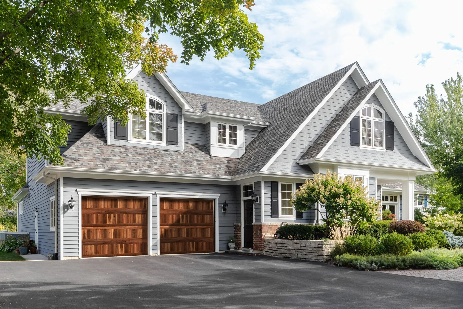 Raynor Aspen insulated steel garage door with decorative windows