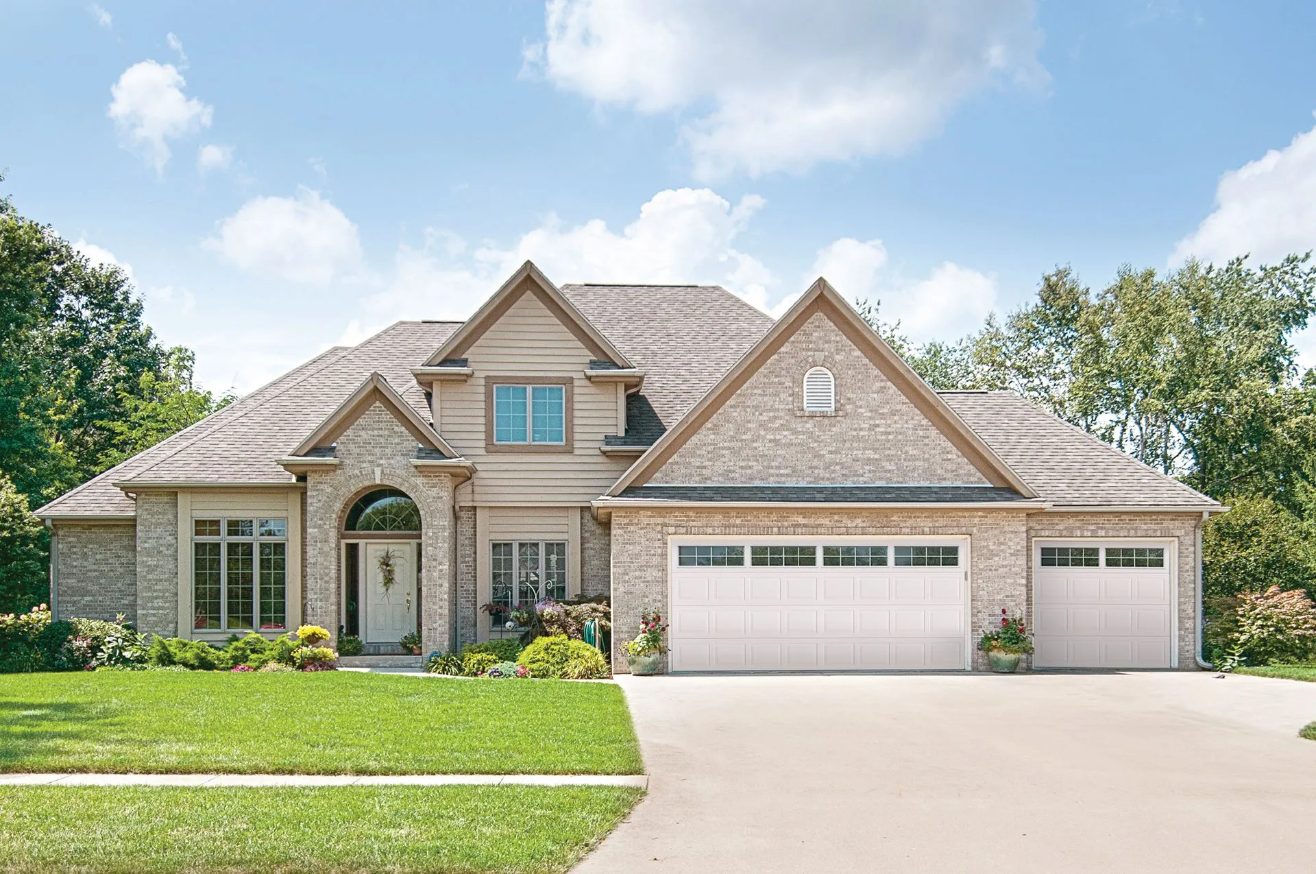 Raynor Aspen LuxeVue garage door with full-view window panels